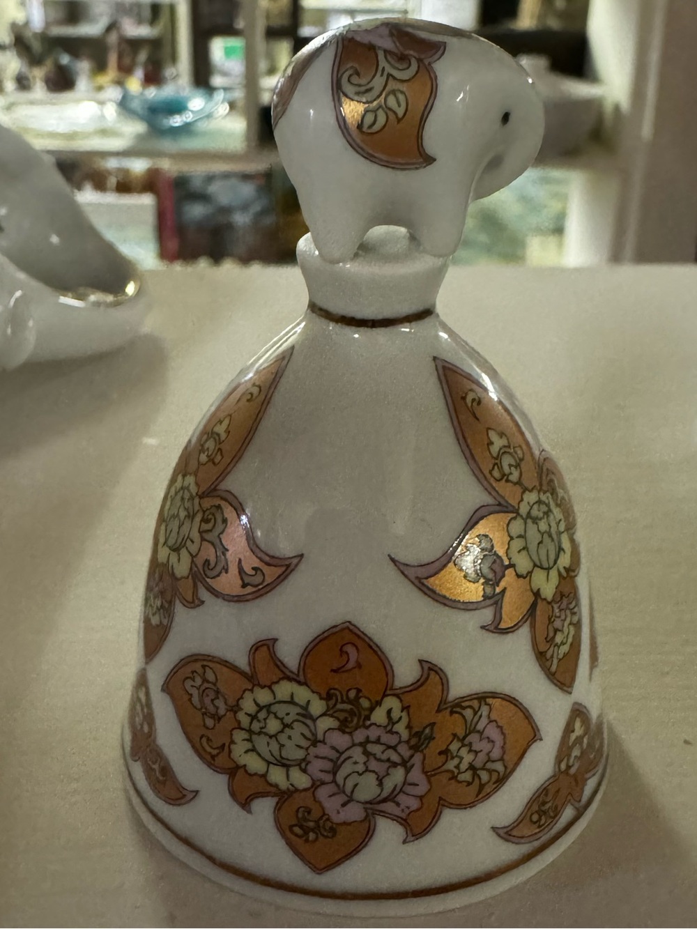 Porcelain Elephant-Topped Decorative Bell in White with Gold Accents